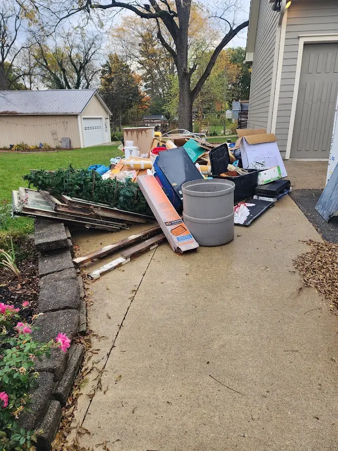 Dumpster being loaded with debris for Roofing Dumpster Rental in Wallkill